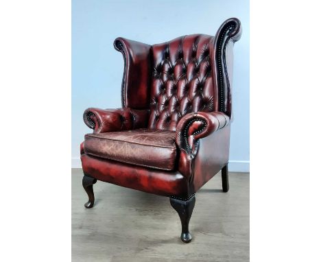 OXBLOOD LEATHER WINGBACK ARMCHAIR, with button backA very well used item. Mould and scuff marks to the side and back of the s