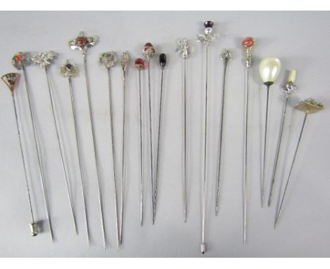 A good collection of silver hat pins to include two examples by Charles Horner set with amethyst coloured terminals, together
