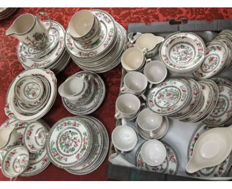 An extensive collection of Johnsons Brothers Indian Tree pattern wares including a pair of serving dishes, sauce boat and two