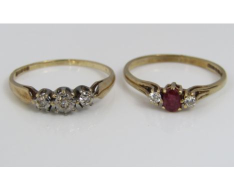 A 9ct diamond and ruby set ring together with a further 9ct three stone diamond ring, both size N, 2.6g total