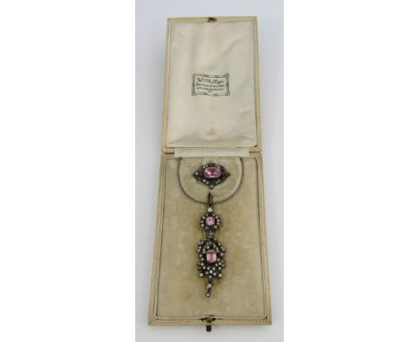 A pink paste set silver demi parure comprising pendant and brooch, pendant including bale 5.7cm approx, on associated 9ct whi