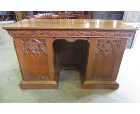 A reclaimed medium to light oak church altar of rectangular form with good quality Gothic tracery and further carved detail, 