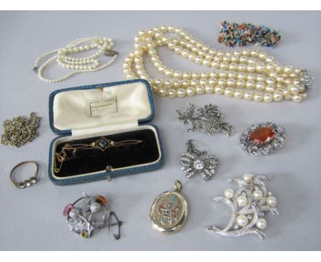 Costume jewellery to include a paste set silver bow brooch, 9ct Edwardian paste set bar brooch and a monogrammed locket with 