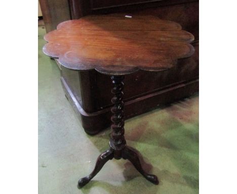 A Victorian rosewood occasional table, the circular flower head shaped top raised on a spiral twist pillar and shaped tripod,