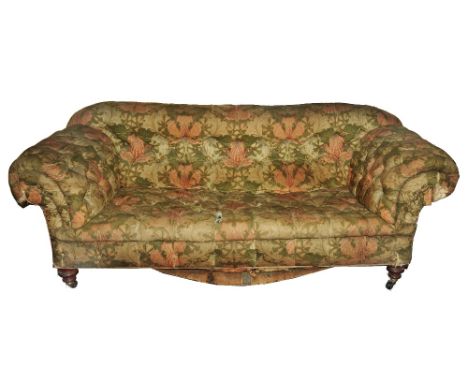 A good Victorian country house button back sofa with scrolled arms, raised on turned mahogany supports with original brass ca