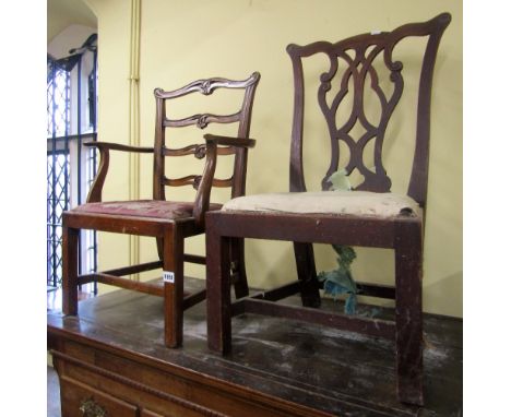 A Georgian mahogany child's elbow chair in the Chippendale manner with pierced ladder back detail, shaped cresting rail, drop