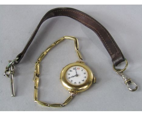 Antique 18ct ladies cocktail watch, the enamel dial with gilt decoration and applied Arabic numerals, the watch with fifteen 