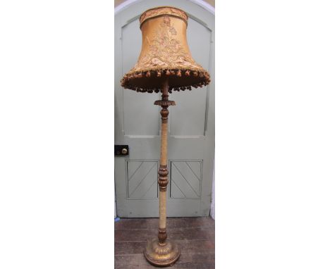 An old country house lamp standard with carved and gilded timber base, the fluted column with further gilded detail and mater