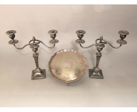 A pair of twin branch candelabra on square tapered columns, with art nouveau embossed styling's, 28cm high, together with a f