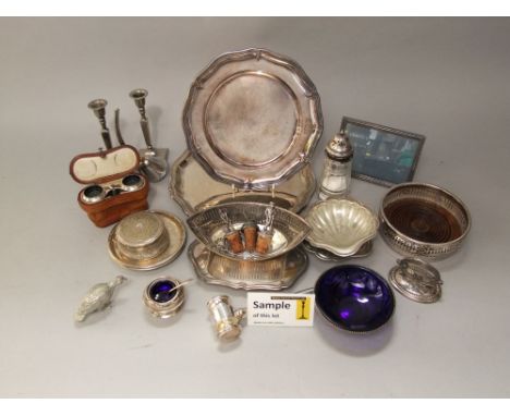 A box containing a collection of silver plated items to include various flatware, candlesticks, pin trays, picture frames, et