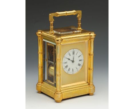 A good quality 19th century French repeating carriage clack by Henri Jacot, with gilt mask and circular enamelled dial fitted