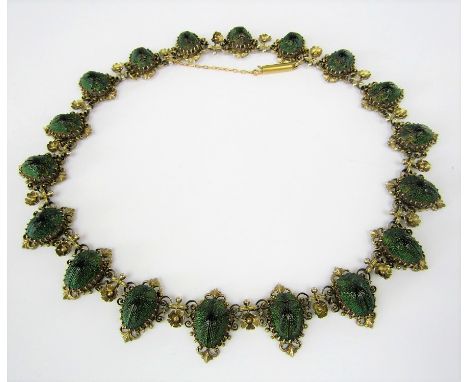 Egyptian revival interest - a Victorian scarab beetle necklace set with eighteen beetles in intricate scrolling mounts with f