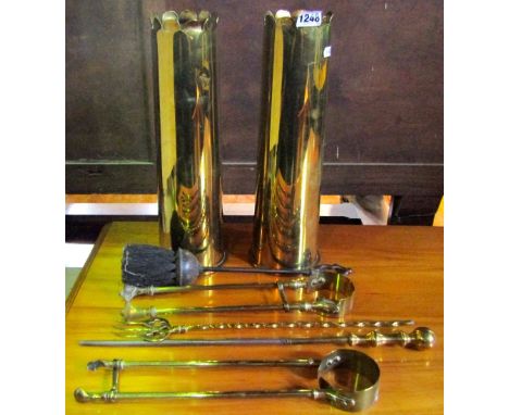 A 19th century copper bed warming pan with turned wooden handle together with two trench art polished brass spent shell cases