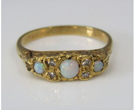 An 18ct opal and diamond ring, size M, 3.5g