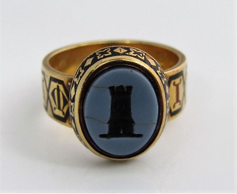 An 18ct gold and enamel mourning ring, the band reading 'IN MEMORIAM', with inscription to inner band 'Thomas Powell, 27 Jan 