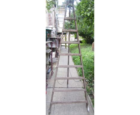 An unusual vintage pine A framed easel type folding step ladder with eight graduated rungs, by Stevens & Carter Ltd (to be so