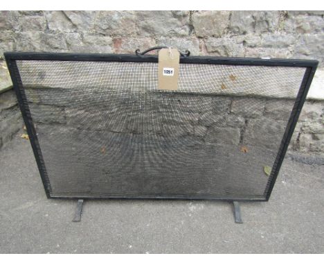 Fireside lot to include a wire mesh panelled firescreen of rectangular form, coal hod, various brass fire irons, and a wicker