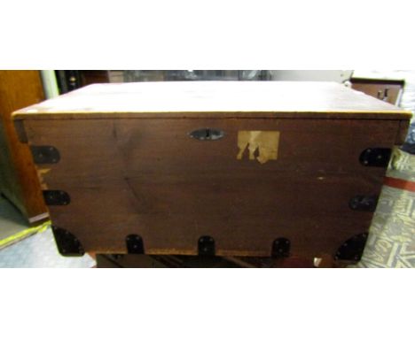 A 19th century stained pine box/trunk with hinged lid and iron fittings