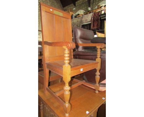 A set of seven (6&1) medium to light oak ecclesiastical chairs, the raised panelled backs with castellated detail over solid 