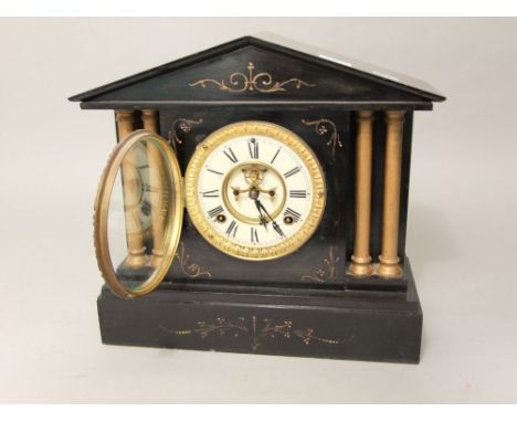 19th century black slate mantle clock with architectural case, the enamel chapter ring with Roman numerals, open escapement a