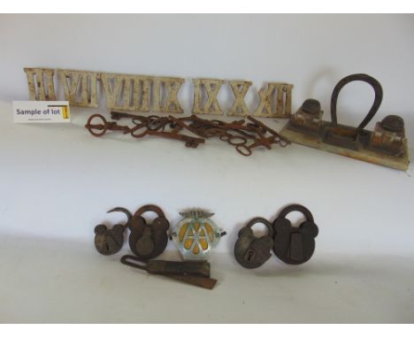 A collection of cast steel turret clock numbers together with a further equine interest desk standish, the inkwells with jock