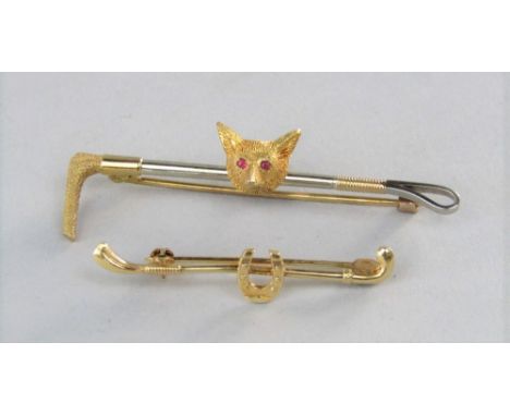 Two 9ct stock pins to include a fox mask example set with ruby eyes, 6.7g total