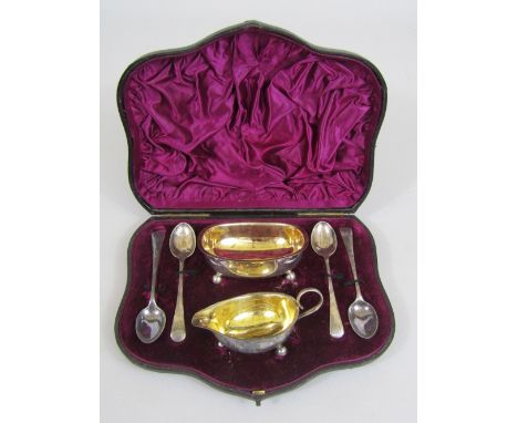 Attractive Victorian cased cruet comprising salt, small jug and four spoons, maker William Hutton & Sons, London 1885, within
