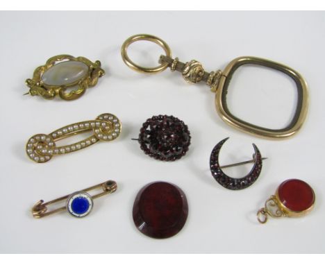 A mixed lot of gold and yellow metal items to include a seed pearl brooch of interwoven design, a magnifier, 9ct swivel fob, 