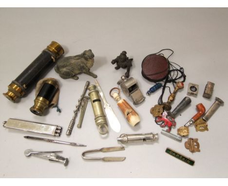 Two 19th century pocket telescopes, a number of vintage whistles, monocle, enamel badges, etc, cold cast painted figure of a 