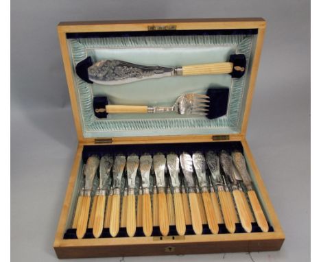 A good quality walnut canteen of various bone handled fish cutlery to include a fish serving knife and fork