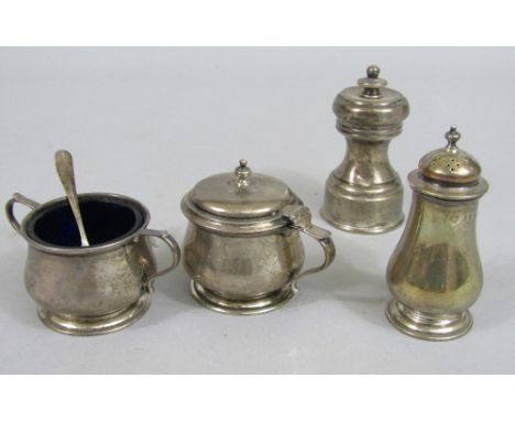 Three piece baluster silver cruet, by The Goldsmiths & Silversmiths Co, the salt and mustard with blue glass liners, with a s