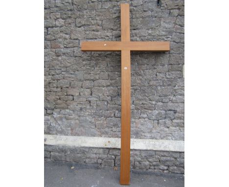 A large contemporary light oak crucifix 252 cm high x 126 cm