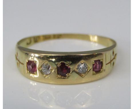An 18ct ruby and diamond gypsy ring, size N, 2.6g