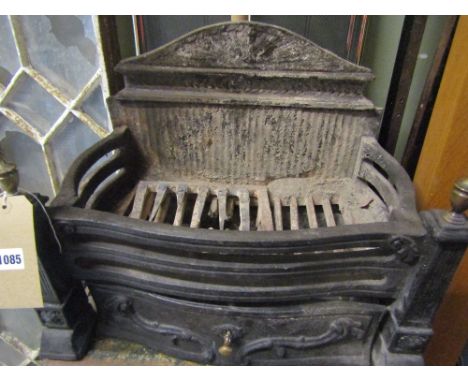 A small Georgian style cast iron fire basket with cast brass urn finial's together with a brass coal helmet, sundry brass fir