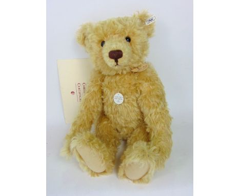 Steiff - "Teddy Boy" a 1905 replica, with original button in ear, tag and certificate, 50cm long