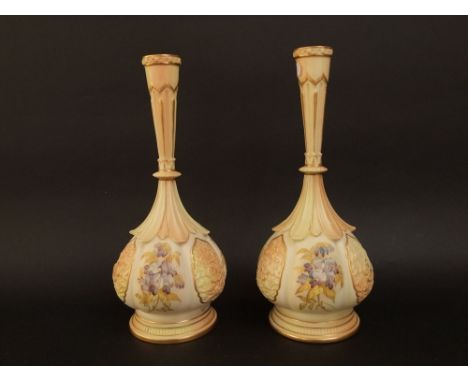 A pair of late 19th century Royal Worcester bottle neck vases with panels of wisteria, with moulded leaf necks and stepped ci