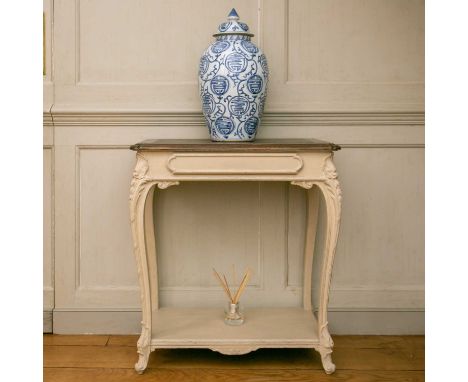 A French 19th century, cream painted oak console table with moulded frieze drawer on harebell cabriole legs united by an unde