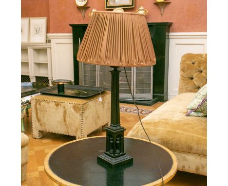 A Victorian patinated bronze architectural table lamp with cluster column support and a niched base on a stepped foot, togeth