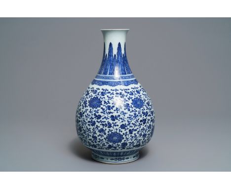 A Chinese blue and white 'peony scroll' bottle vase, Qianlong ----- H.: 43 cm  -----  Condition reports and high resolution p