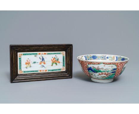A Chinese famille verte plaque with playing boys and a landscape bowl, Kangxi: Dia.: 19 cm - H.: 9 cm (the bowl)Dim.: 18,5 x 