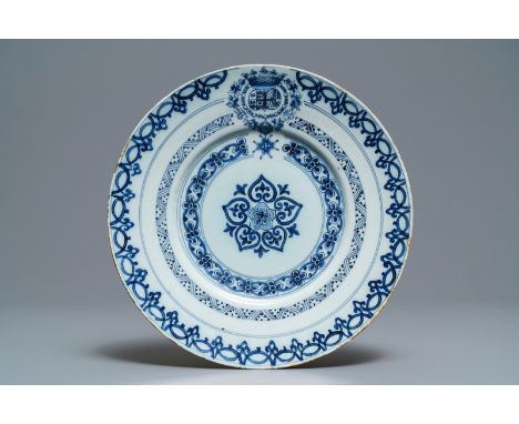 A Dutch Delft blue and white armorial plate, 2nd half 17th C.: Dia.: 25,5 cm  Marked SVE on the base for Samuel van Eenhoorn,
