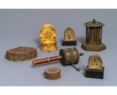 A varied collection of Tibetan votive objects, 19/20th C. ----- H.: 14,5 cm (the revolving temple-shaped altar object)L.: 22 