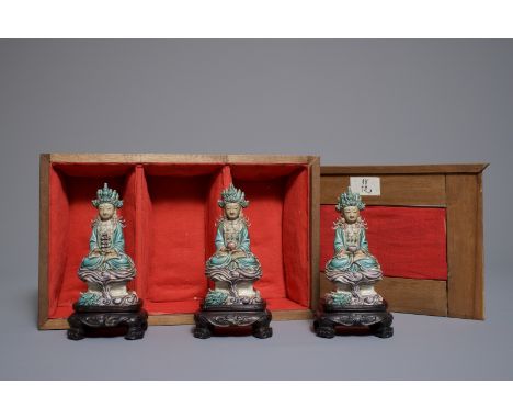 Three Chinese enamel on biscuit figures of Buddha, 19/20th C. ----- H.: 15 cm (each figure incl. base) -- H.: 12 cm (each fig