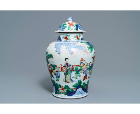 A Chinese wucai vase and cover with figures in a garden, seal mark, Transitional period ----- H.: 42 cm  Provenance: Beurdele