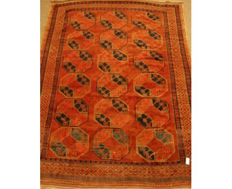 Persian red ground rug carpet, with repeating Gul design, cross hatch border, 304cm x 212cm   Condition Report   Click here f