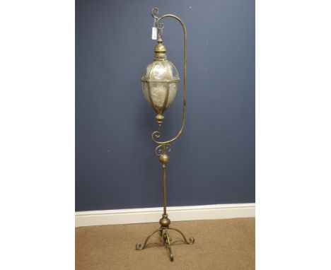 Floor standing ornate gilt metal hanging lantern on four scrolled feet, H162cm   Condition Report   Click here for further im