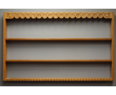 Craftsman made light oak three tier wall plate rack, frieze carved with lunettes and Yorkshire Roses, W102cm, H63cm   Conditi