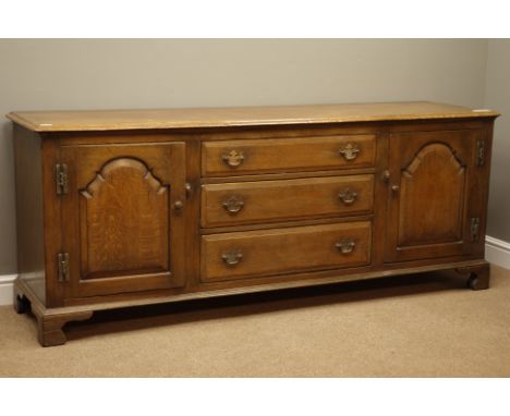18th century style oak dresser base, rectangular moulded top above three drawers and two cupboards enclosed by fielded panell
