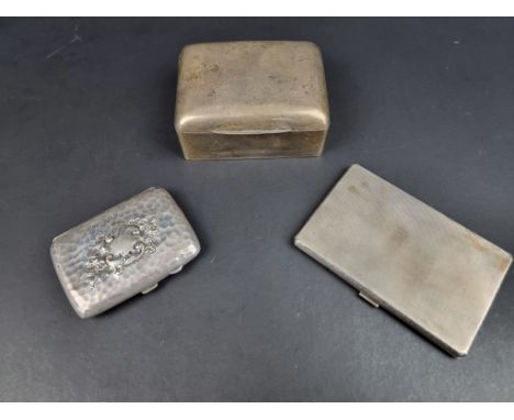 A silver mounted cigarette box, by W H Haseler Ltd, Birmingham 1923, 11cm wide; together with two silver cigarette cases, 277