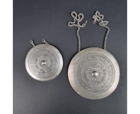 A vintage Christian Dior 'Aztec' pendant necklace&nbsp;and matching brooch, 94mm diameter and 67mm diameter respectively. (2)